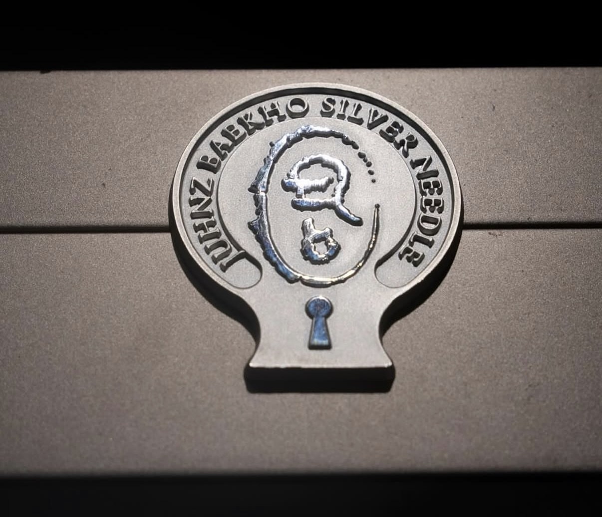 Close detail of the JUHNZ Silver Needle seal on the ritual box